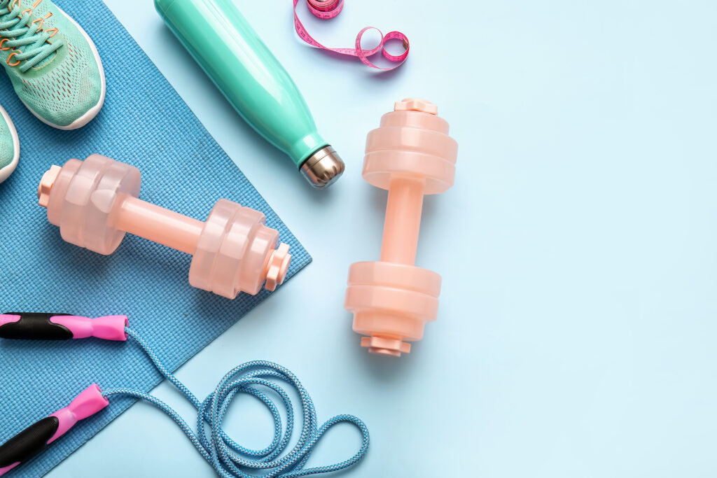 Exercise equipment including sneakers, weights, and a jump rope against a blue background.
