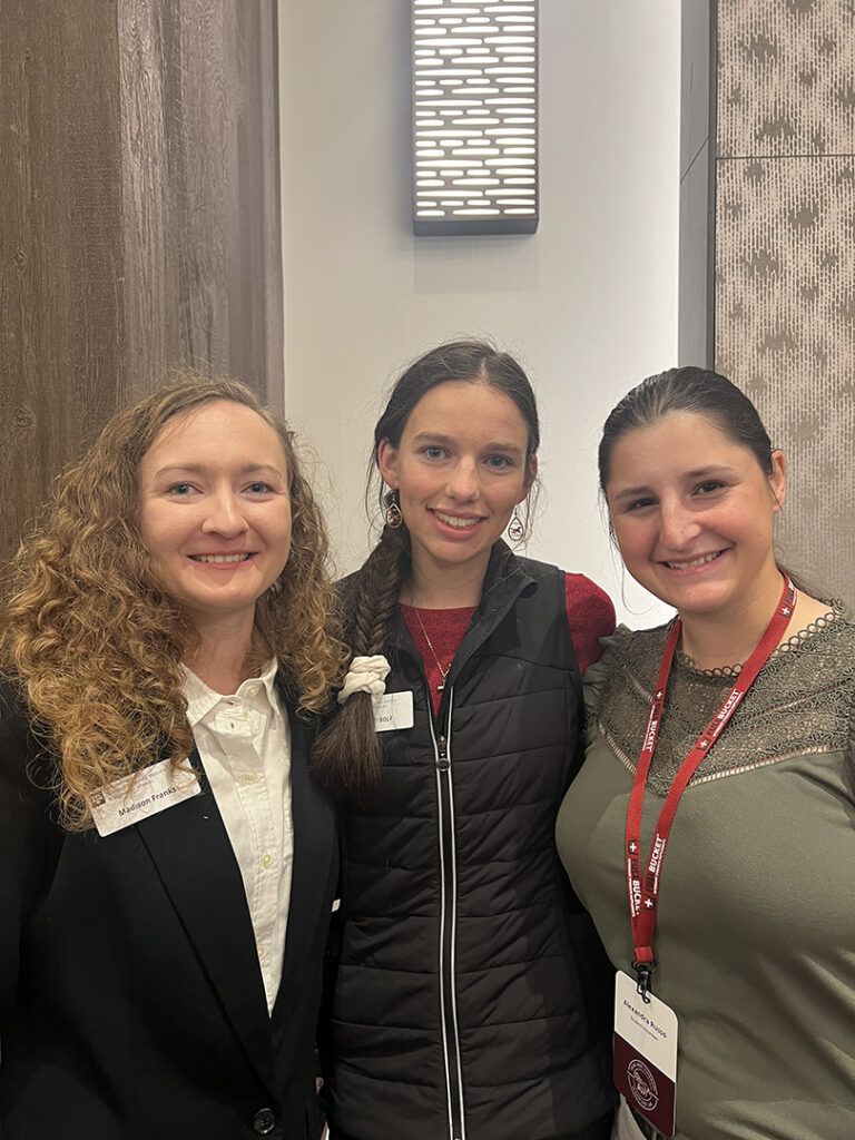 Allie stands with two veterinary students at the Equine Practice Career Fair