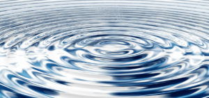 photo of concentric waves in blue water
