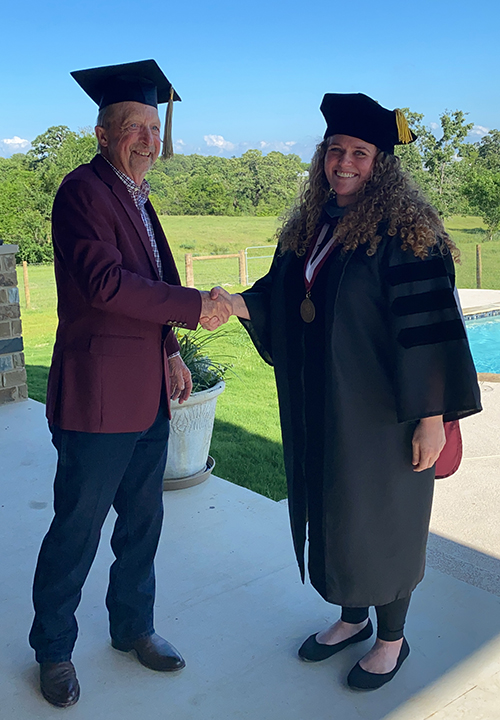 Carissa Dale in graduation regalia