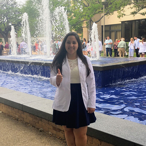 Danielle Covarrubias in white coat