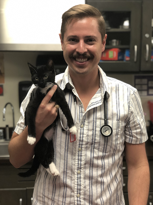 Daniel Olson with a cat