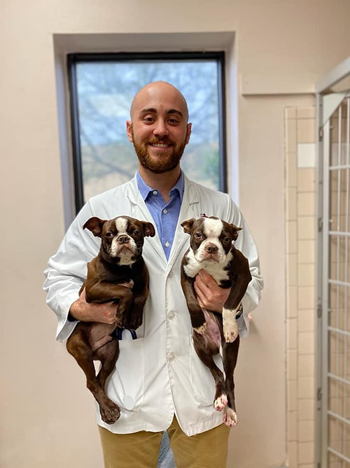 Devyn Schultz with two dogs