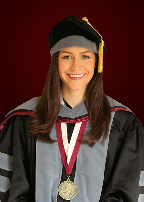 Erika Wiggs in graduation regalia