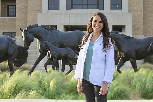 Gabriela DeLima in a white coat