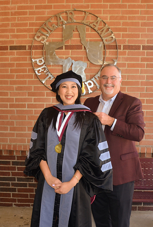 Kathaleen Bailey in graduation regalia