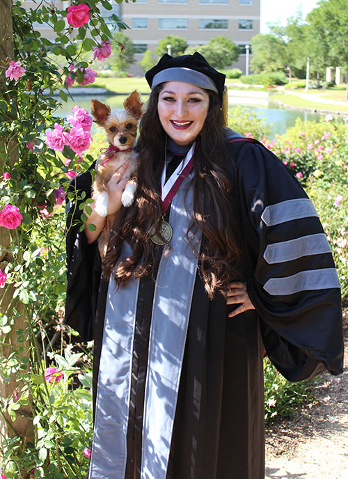 Kelly D’Ancicco in graduation regalia