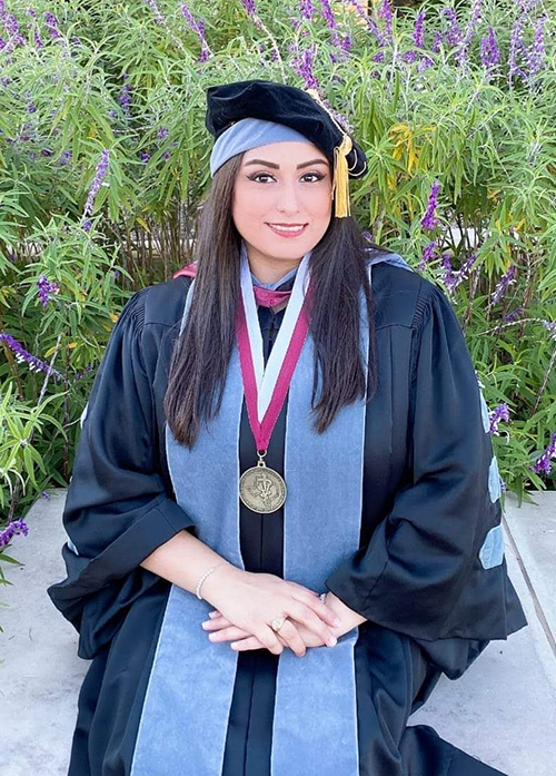 Meagan Gonzales in graduation regalia