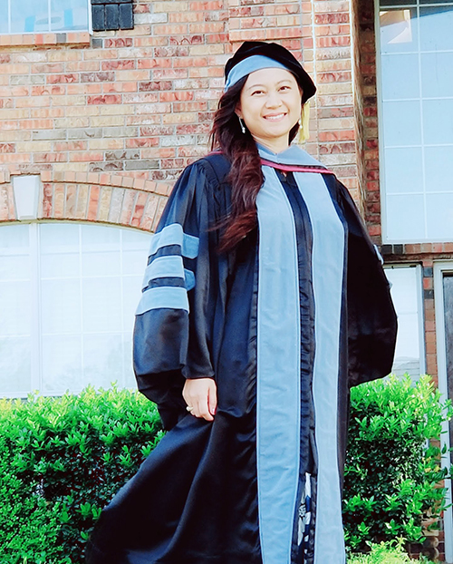 Nantika Du in graduation regalia