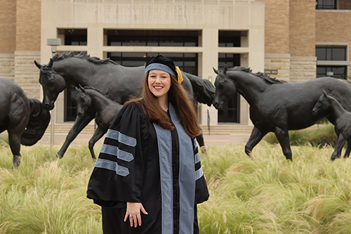 Jenna Ward in graduation regalia