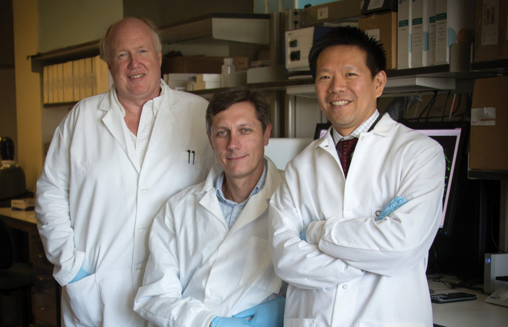 three professors in lab coats
