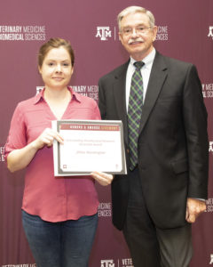 Jill receives her award from Dr. Bob Burghardt
