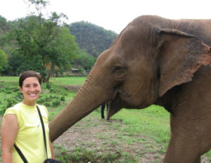 student with elephant