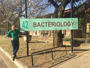 Taylor Pursell in front of Tuberculosis Laboratory
