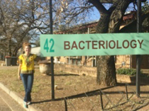 Laura Warren in front of Tuberculosis Laboratory 