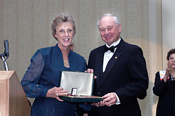Dr. Bonnie Beaver receives her award from Dr. Jack O. Walther