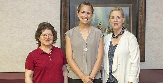 Dr. Evelyn Tiffany-Castiglioni (left) and Dr. Eleanor M. Green (right) celebrate with Dr. Sarah Hamer (center)