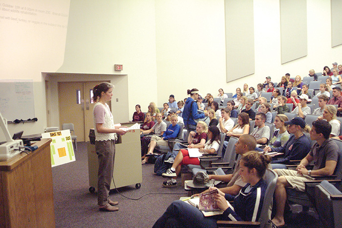 Dr. Elizabeth Crouch lecturing to students.