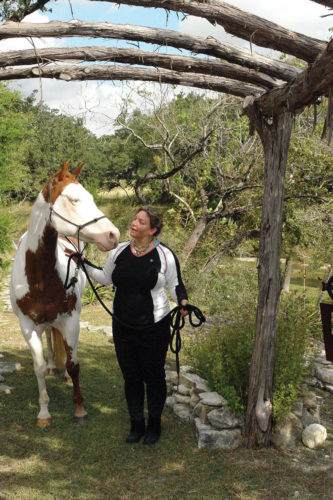 Jenny Good walking with her horse