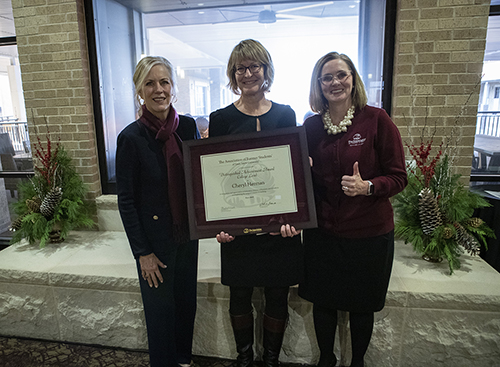 Dean Eleanor M. Green, Dr. Cheryl Herman, and Kathryn Greenwade with the award certificate