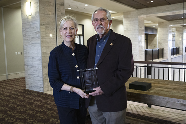 Dean Eleanor M. Green and Dr. Sonny Presnal with his award