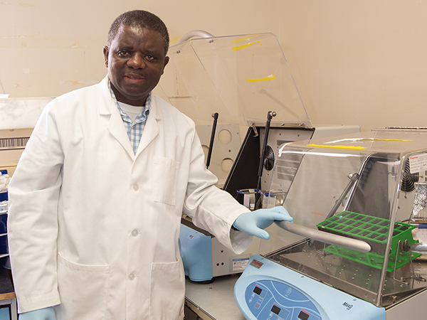 Dr. Albert Mulenga in his lab