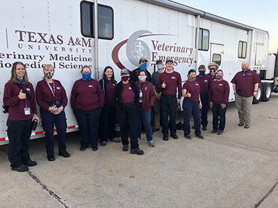 several VET members some in masks in front of VET vehicles prior to deploying to Polk County, TX on April 25, 2020