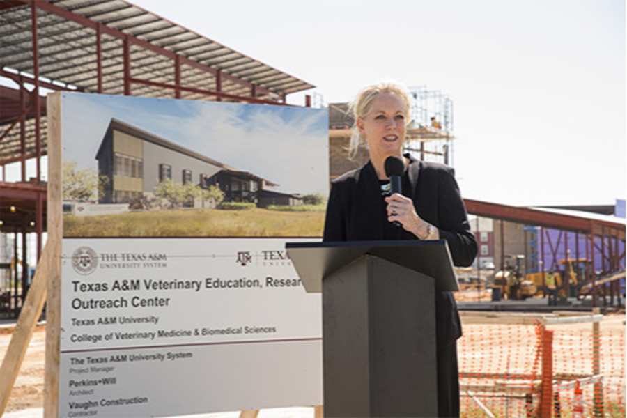 Dr. Eleanor M. Green in front of building construction at West Texas A&M