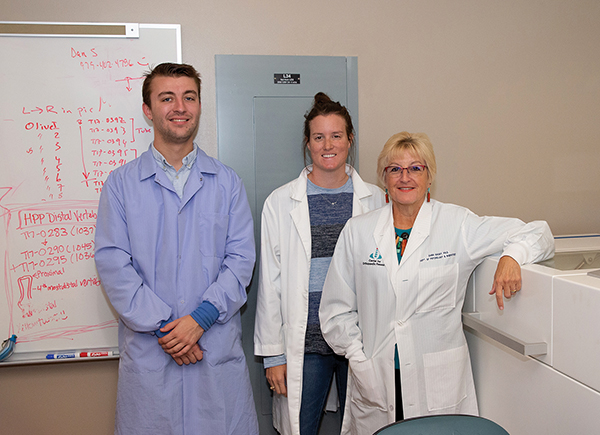 Joshua Bertles, Kirby Sherman, and Dr. Dana Gaddy in the lab