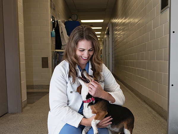 Dr. Ashley Saunders holding Birdie the dog