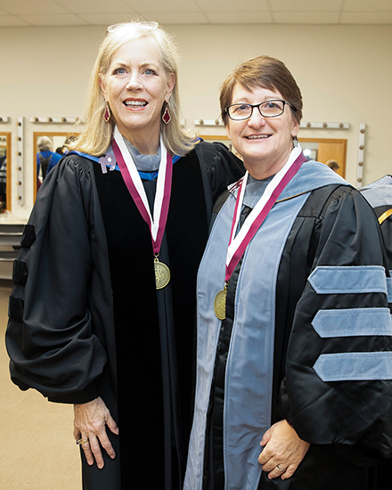 Dean Eleanor M. Green and Dr. Karen Cornell in graduation regalia