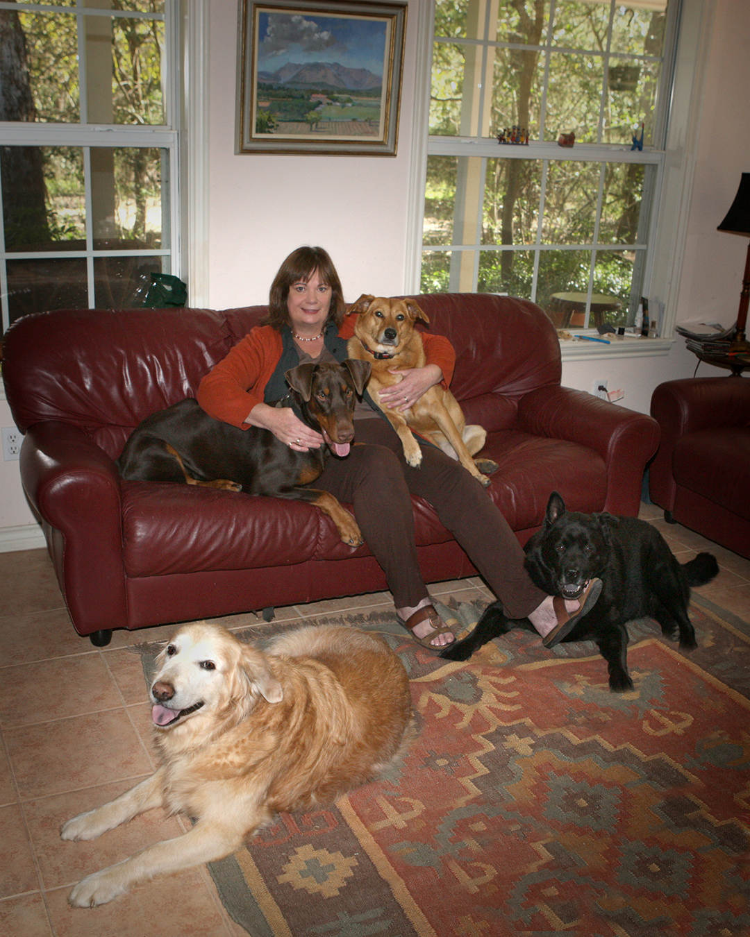 Dr. Jane Welsh at home with her four dogs