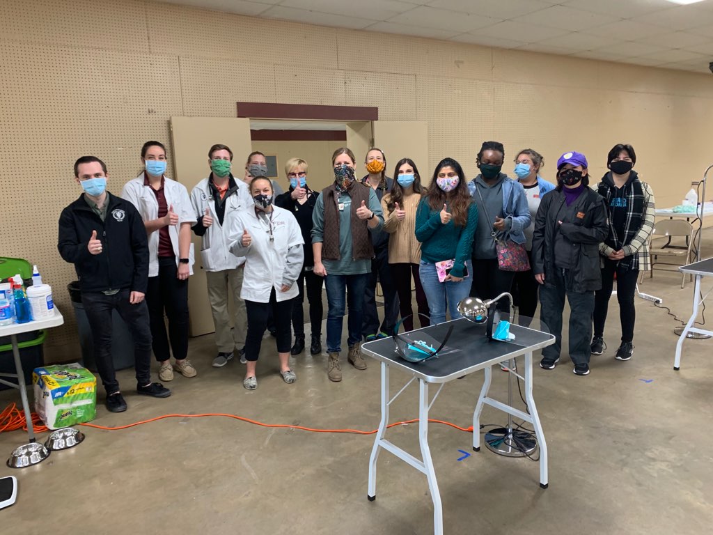 A group of Texas A&M students, faculty, and staff in masks