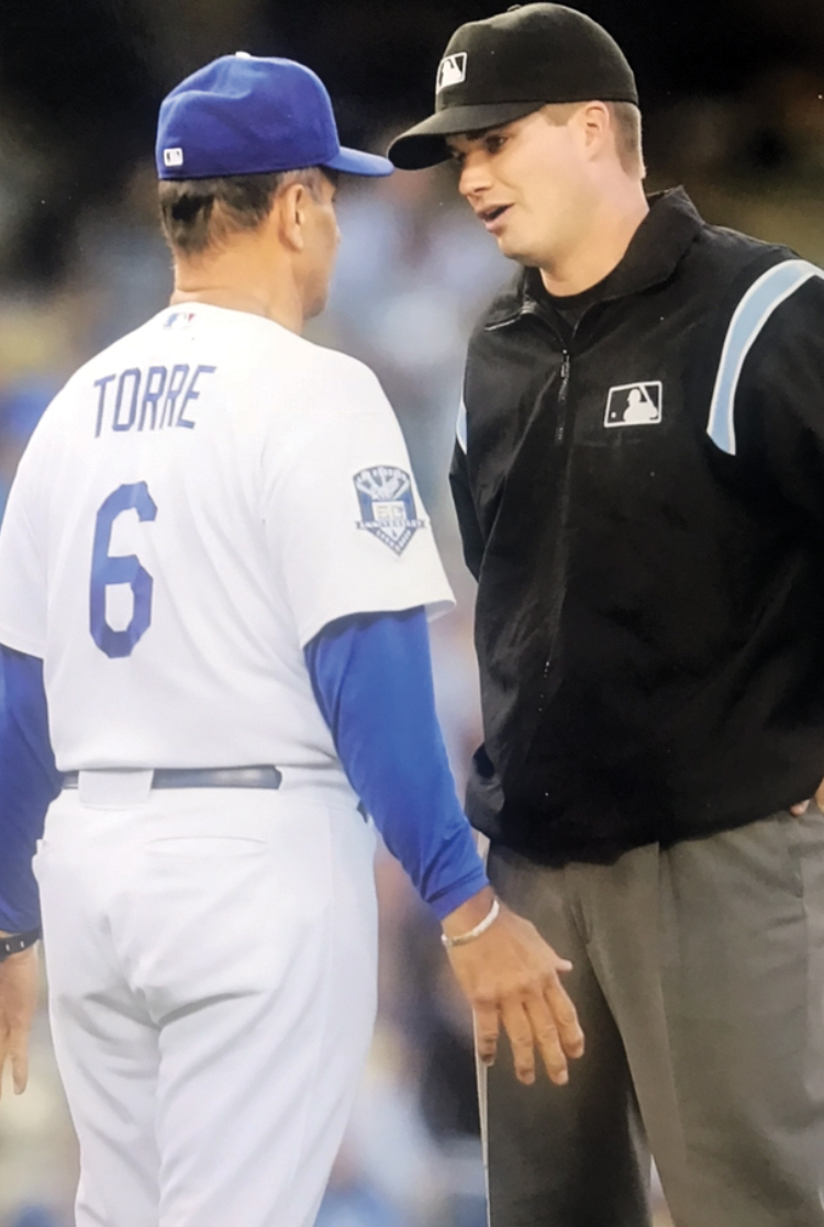 Chris Tiller and Joe Dorre, in a baseball uniform, talking