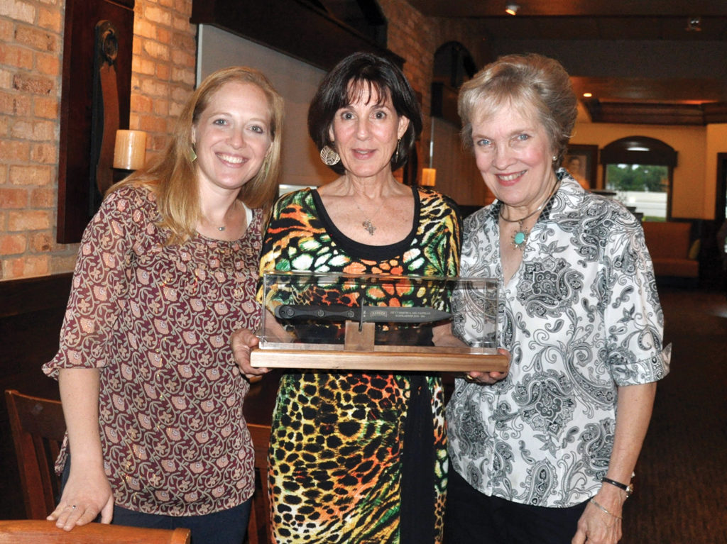 Monika Blackwell, Catherine del Castillo holding Dimitri's knife, and Linda McCormick