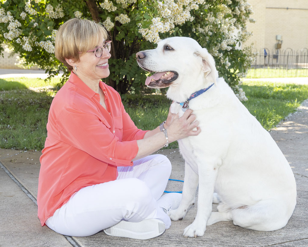 Lori Teller with a white dog