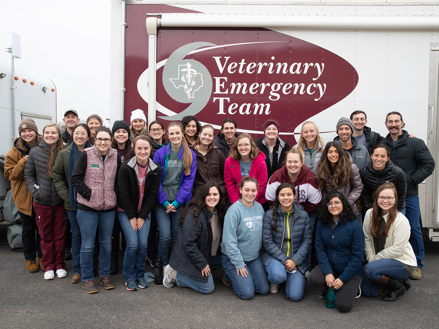 students in front of a Veterinary Emergency Team truck