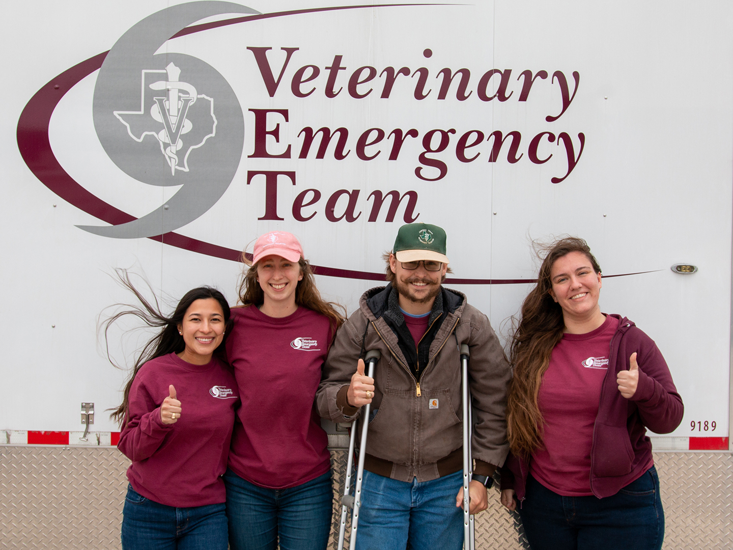 four students in front of the VET truck