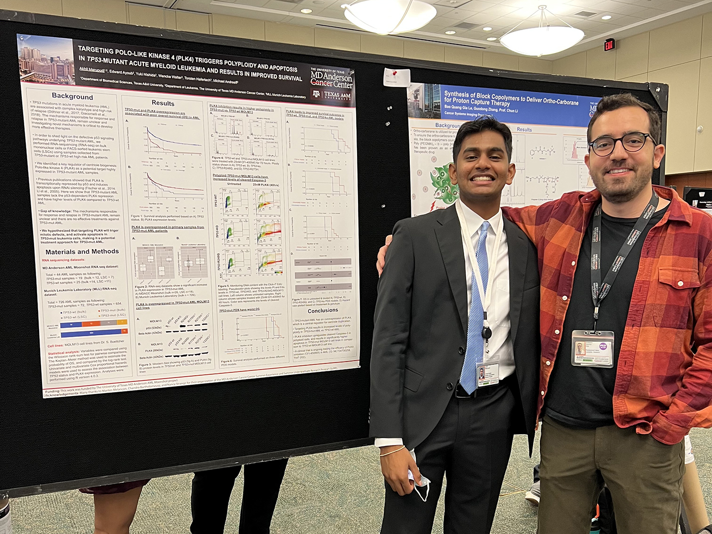 Marupudi and Ayoub next to their poster