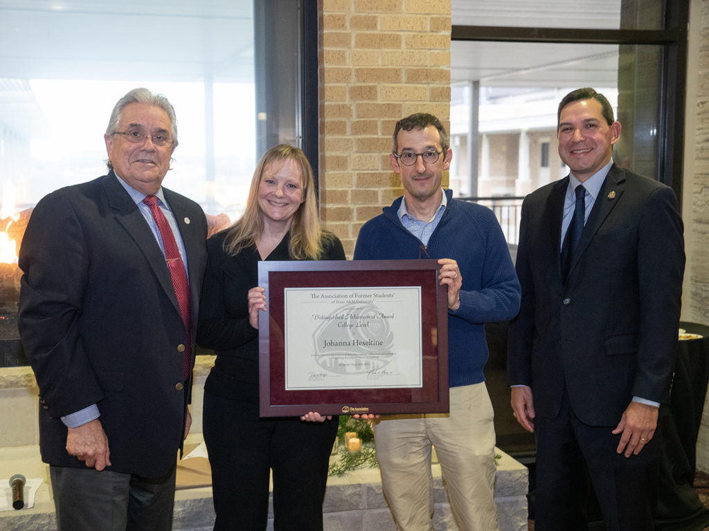 Dr. John August, Dr. Johanna Heseltine, Dr. Jon Levine, and Andrew Arizpe with an AFS college-level award certificate