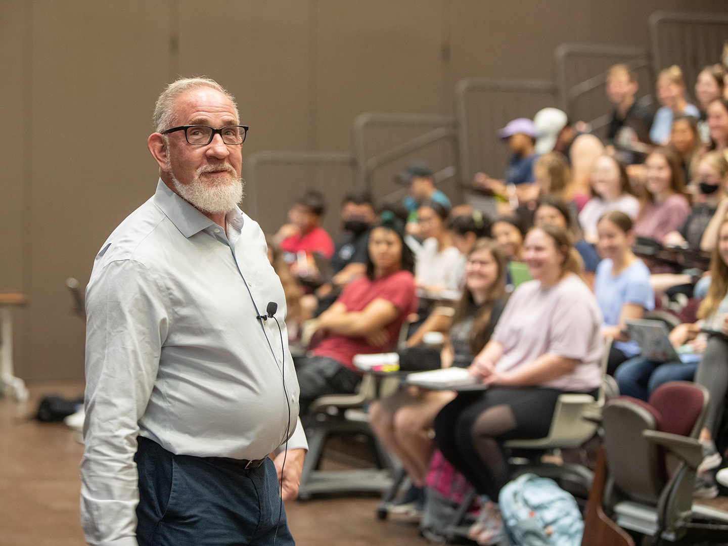 Dr. James Herman in front of a classroom full of students