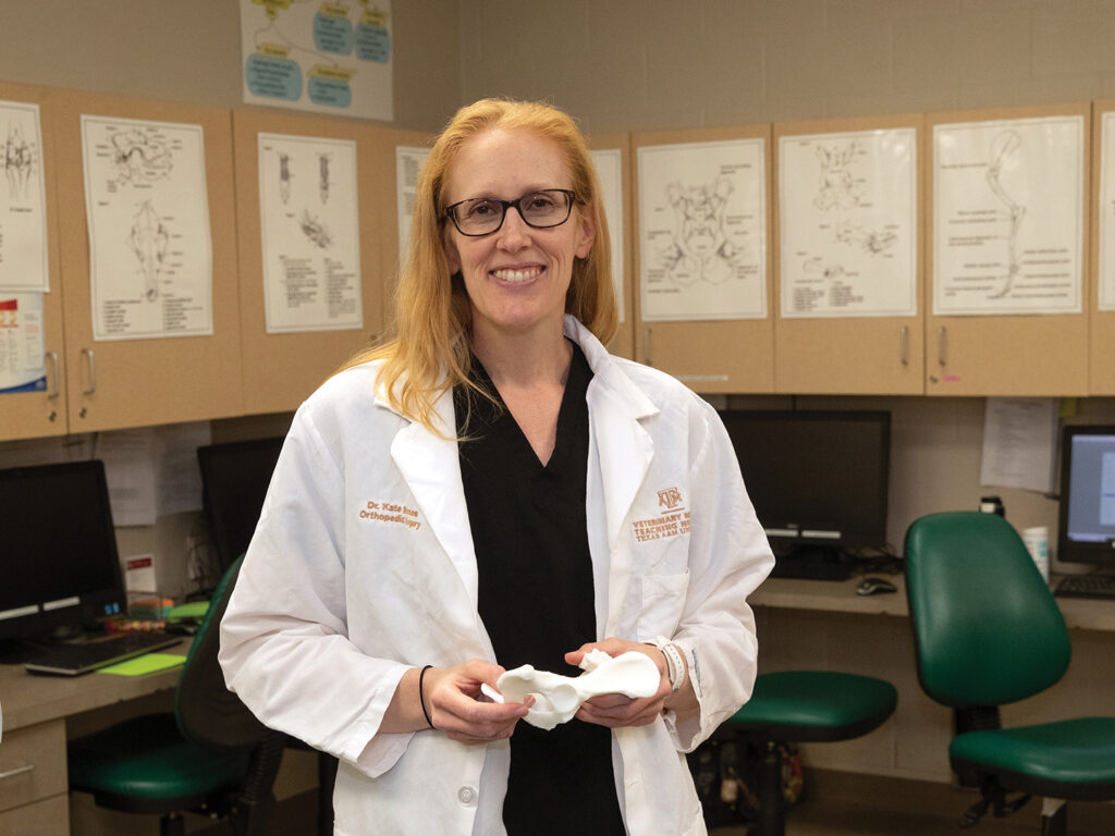 Dr. Kate Barnes holding a 3D-printed bone