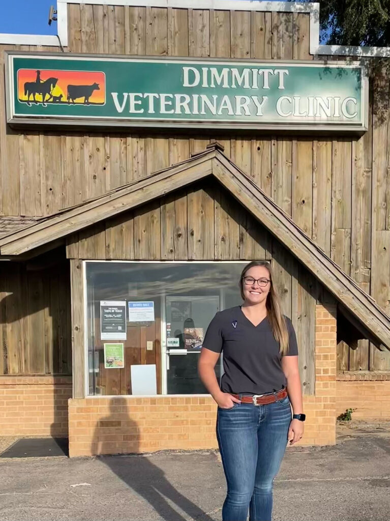 Dr. Ashlee Ambs in front of Dimmitt Veterinary Clinic