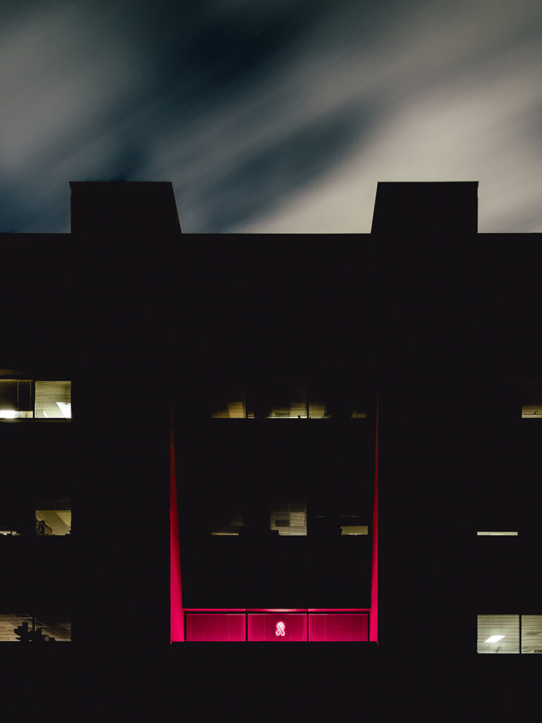 The exterior of Dr. Weston Porter’s laboratory lit up for breast cancer awareness month