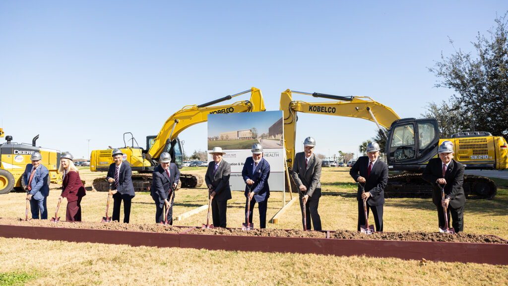 Texas A&M administrators shoveling dirt at the groundbreaking