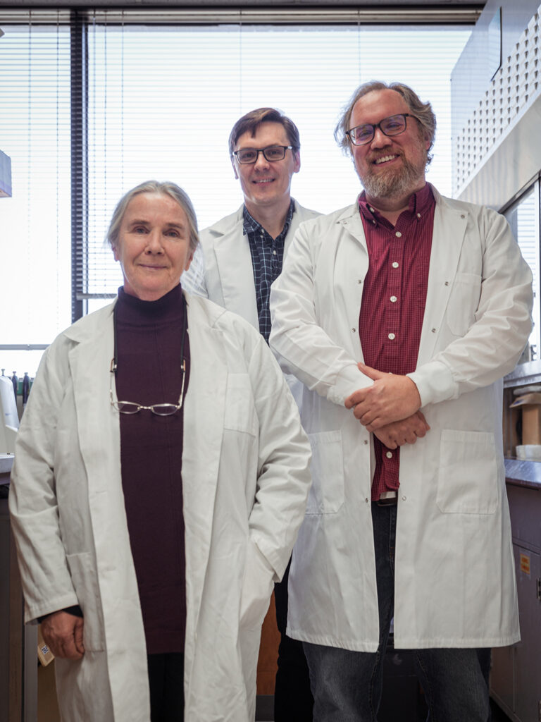 Three researchers in lab coats