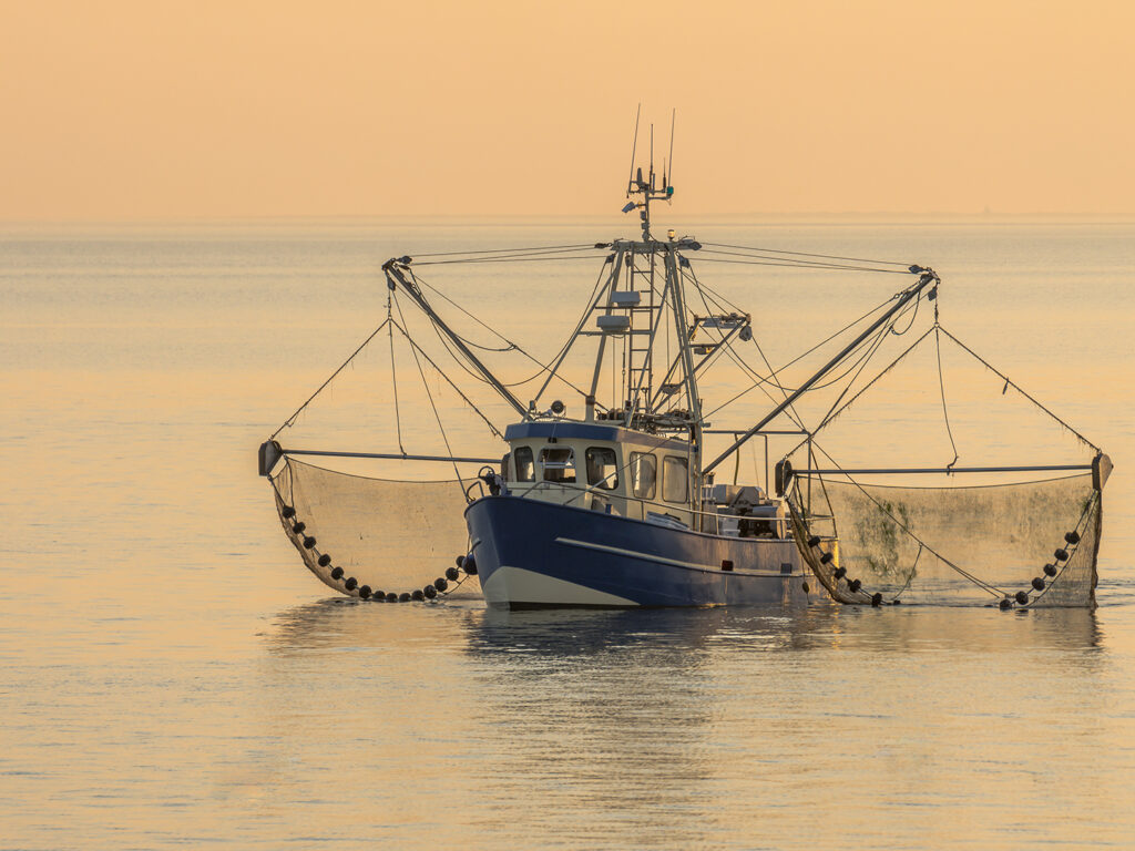 A fishing boat with nets in the water