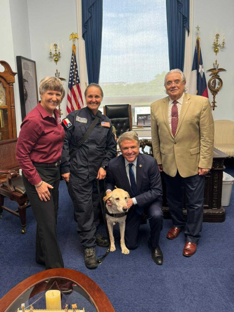 Zoran, Bormann, McCaul, August, and a K-9 in McCaul's office