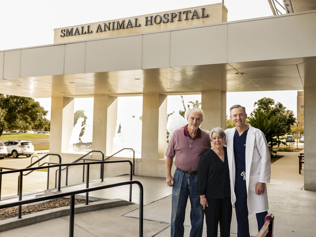 Linda and Dennis Clark with Dr. Brian Saunders in front of the Small Animal Hospital