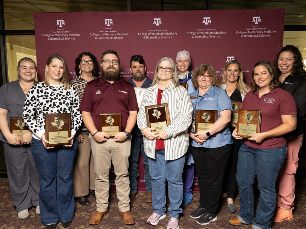 2024 Staff Award winners with their plaques